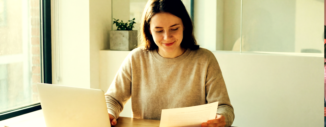 happy woman at desk working from home
