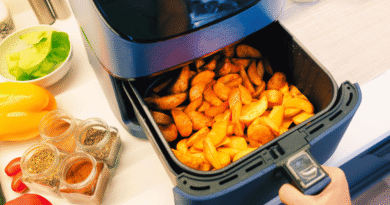 air fryer in a kitchen filled with potato wedges