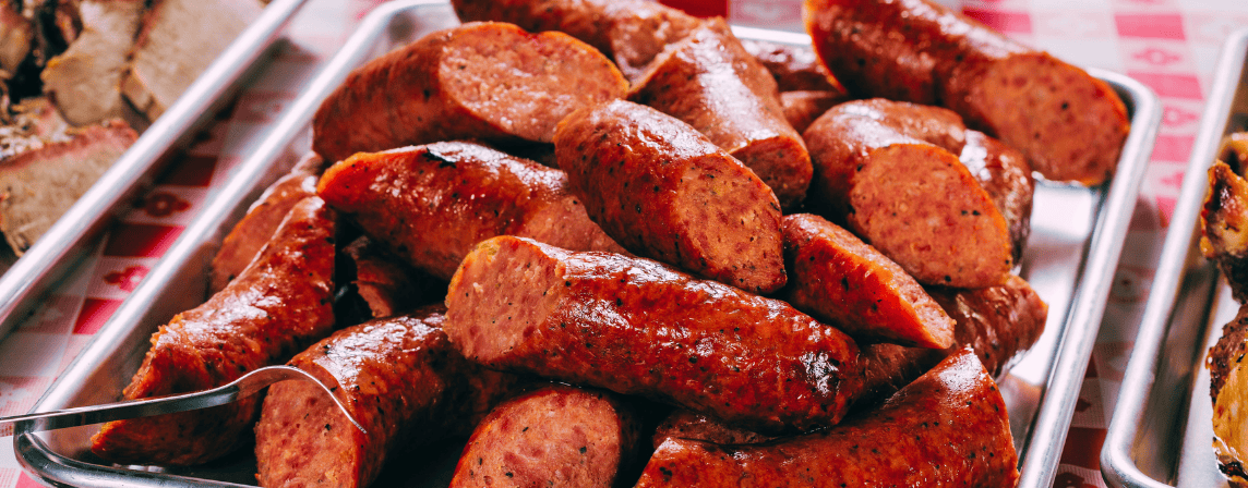 cooked, sliced sausages