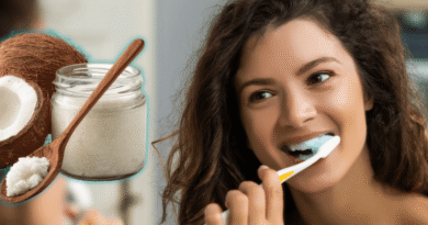 woman brushing her teeth with coconut oil