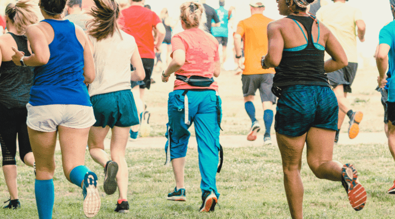 group of adults in a communal park run